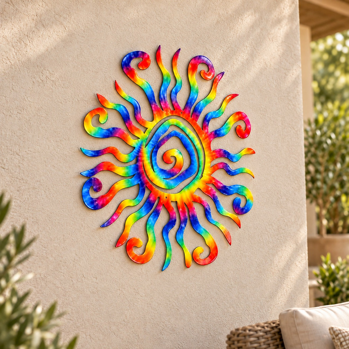 Printed Wacky Sun Tye Dye 24-inch rainbow metal wall art displayed on a patio wall