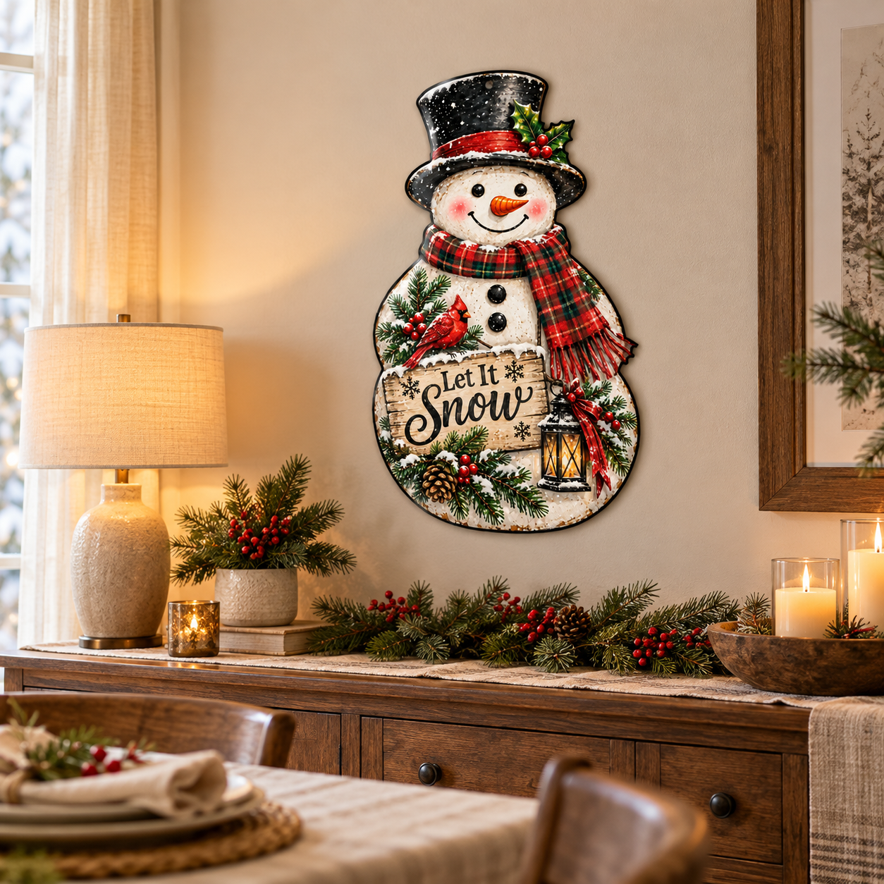 Lifestyle mockup of Let it Snowman 24-inch Gloss printed steel wall art displayed above a dining room sideboard with winter greenery